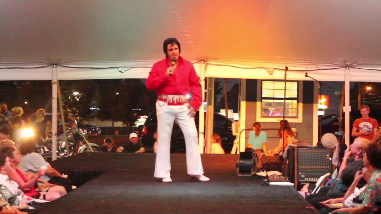 Mike Adams gives his Elvis Presley scarf to it's original owner David Whitaker EW 2014