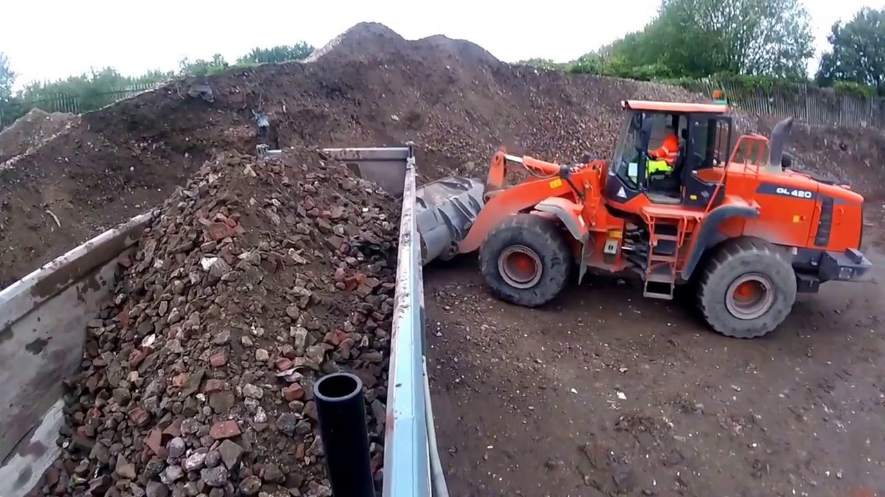 Loading crushed brick via loading shovel
