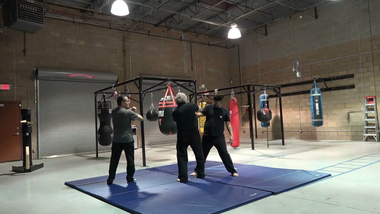 Under arm grab from behind option 1