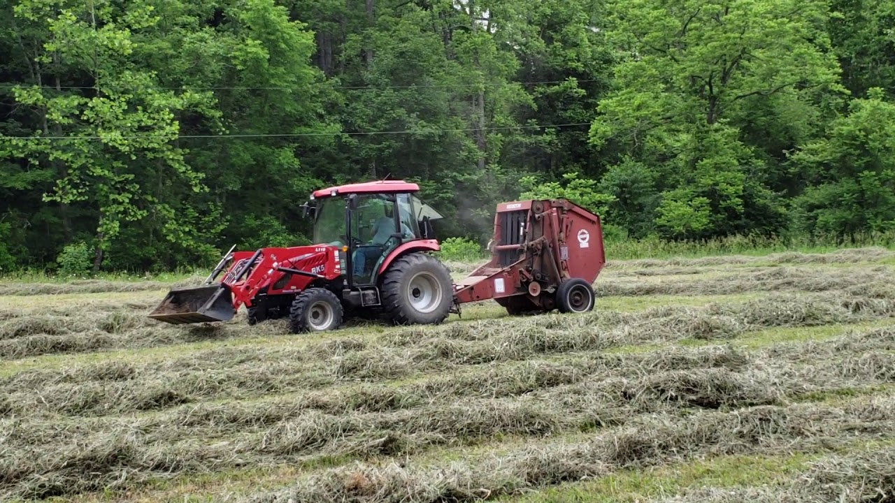 Rural King RK55 baling hay with Hesston 5530 baler