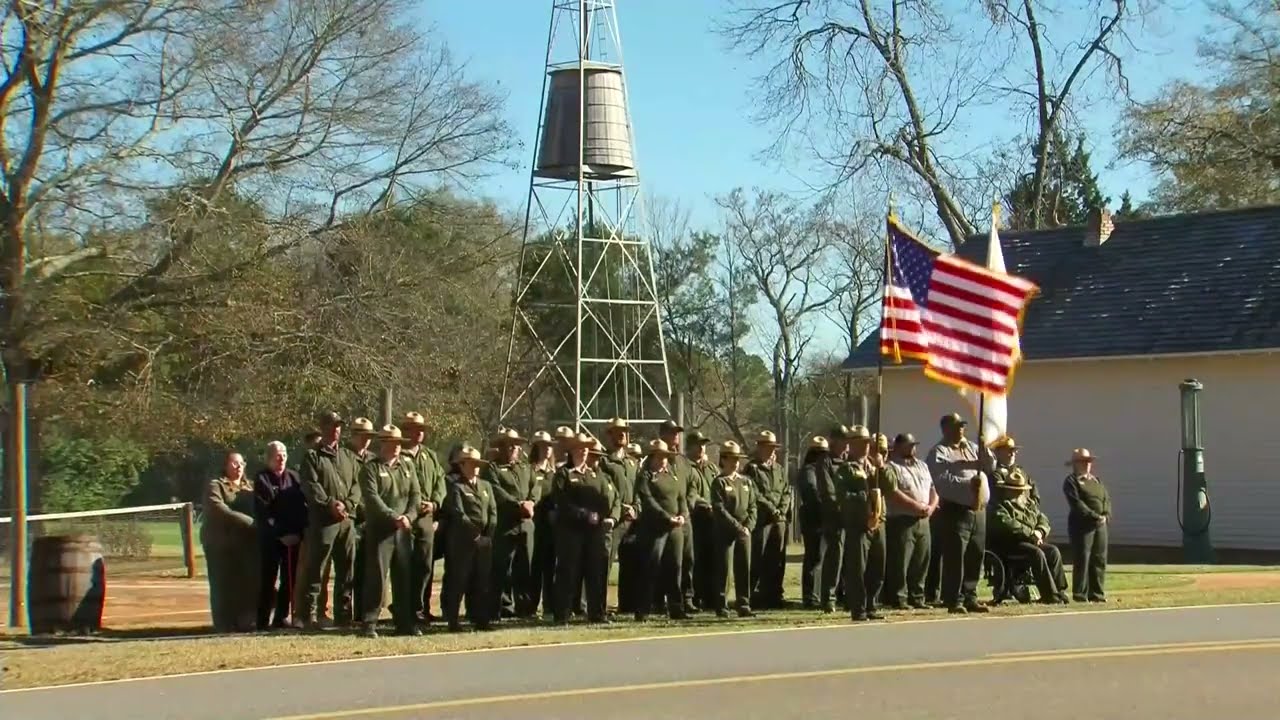 Hearse stops at Jimmy Carter's childhood home in Plains, GA, during president's funeral procession