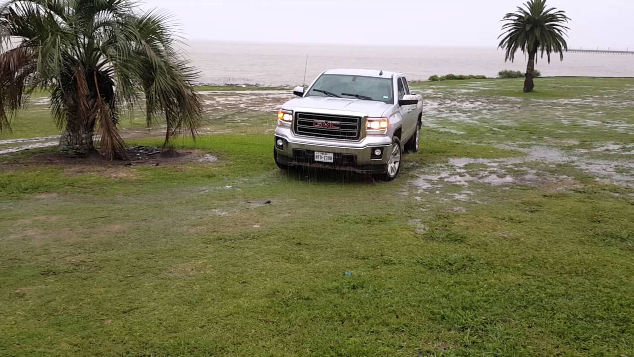 2015 GMC Sierra(Stock) driving through some light mud