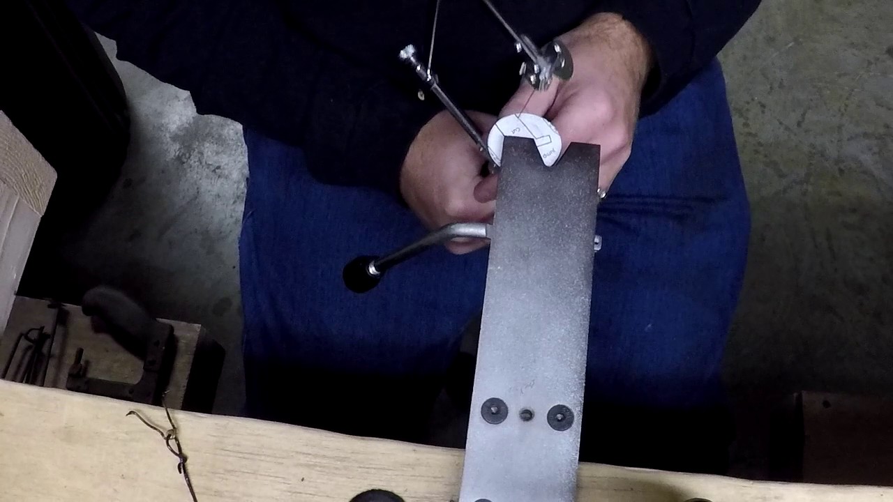 Cutting Coins - Turning an Eisenhower Dollar into a Spartan Mask Necklace