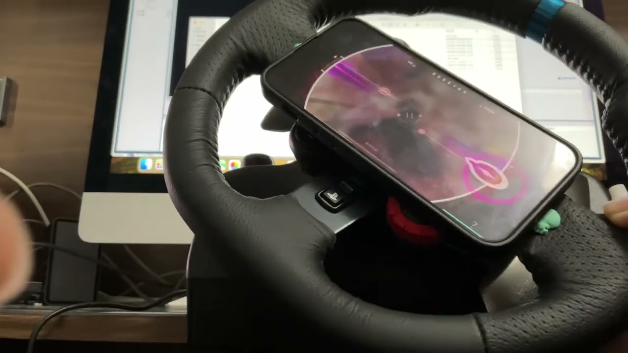 Bro attempting to play Rotaeno on a steering wheel
