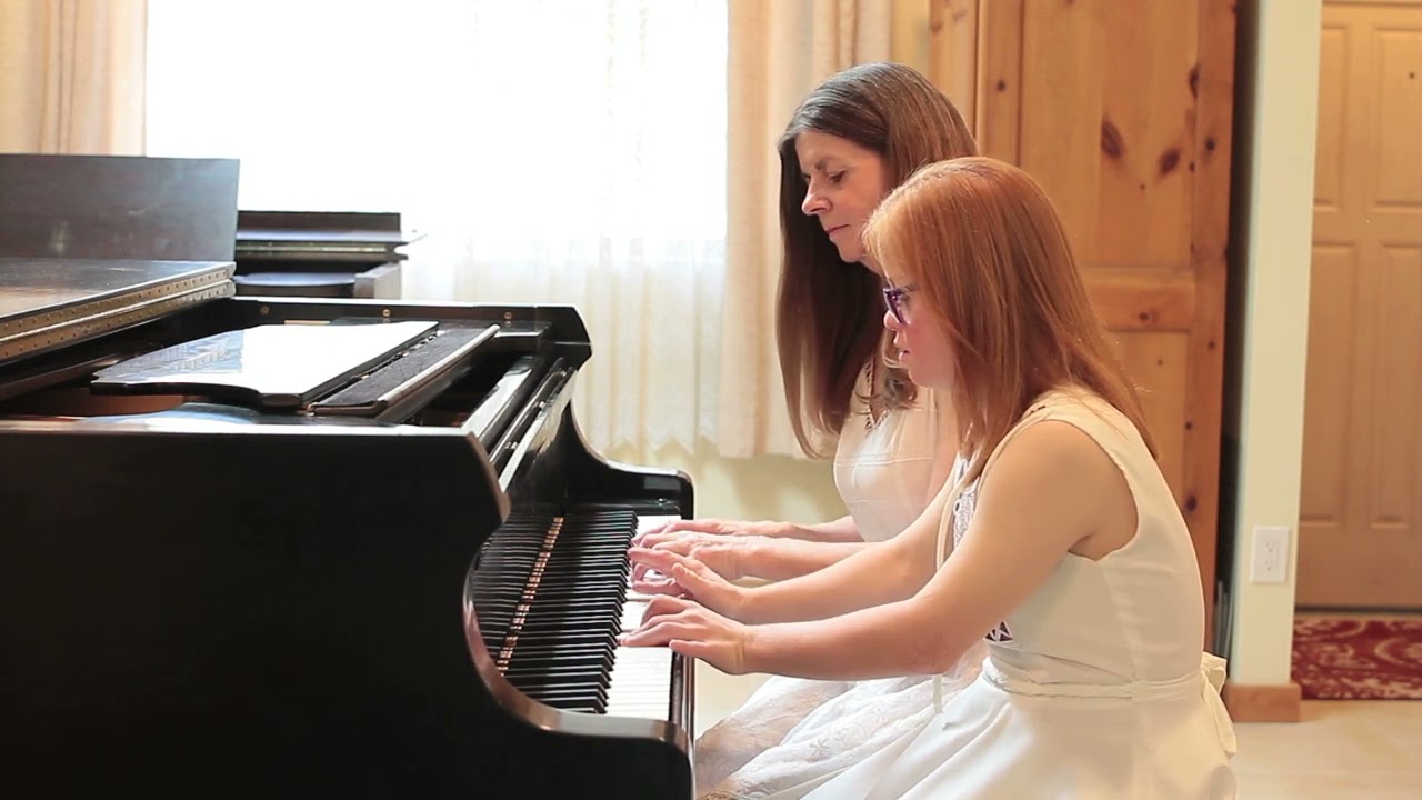 Girl with Down syndrome plays Twinkle Little Star Duet