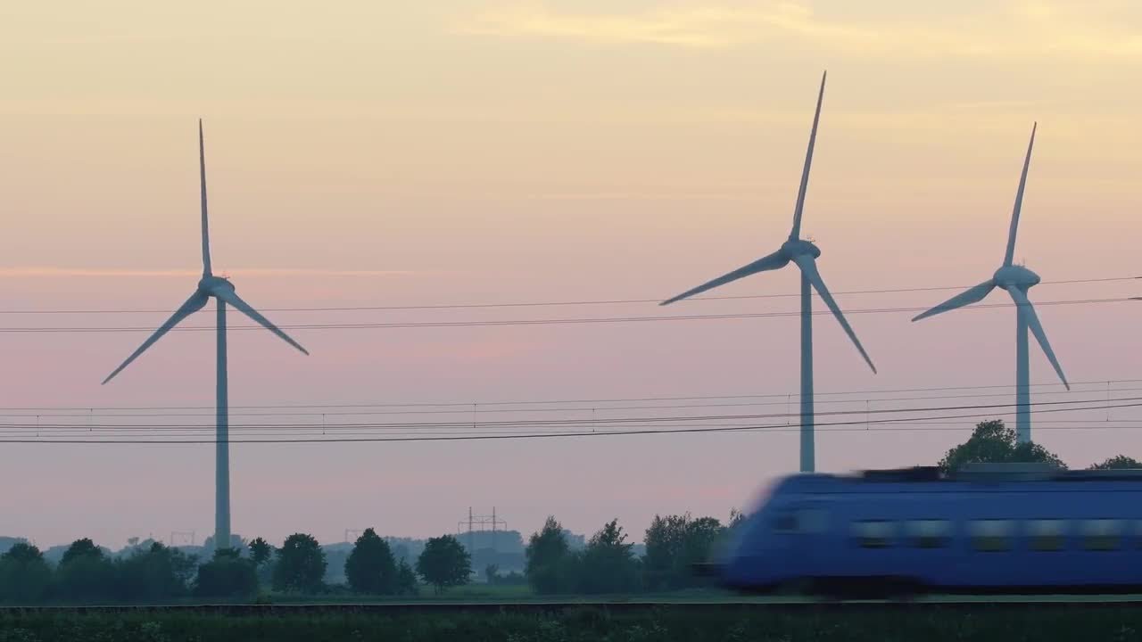 Train And Clean Energy Wind Turbines Stock Video