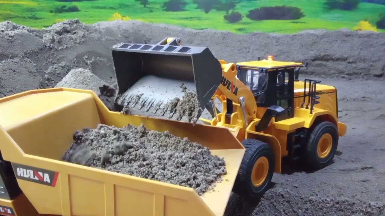 Rc loader loads sand into Rc Dump Truck at mine site