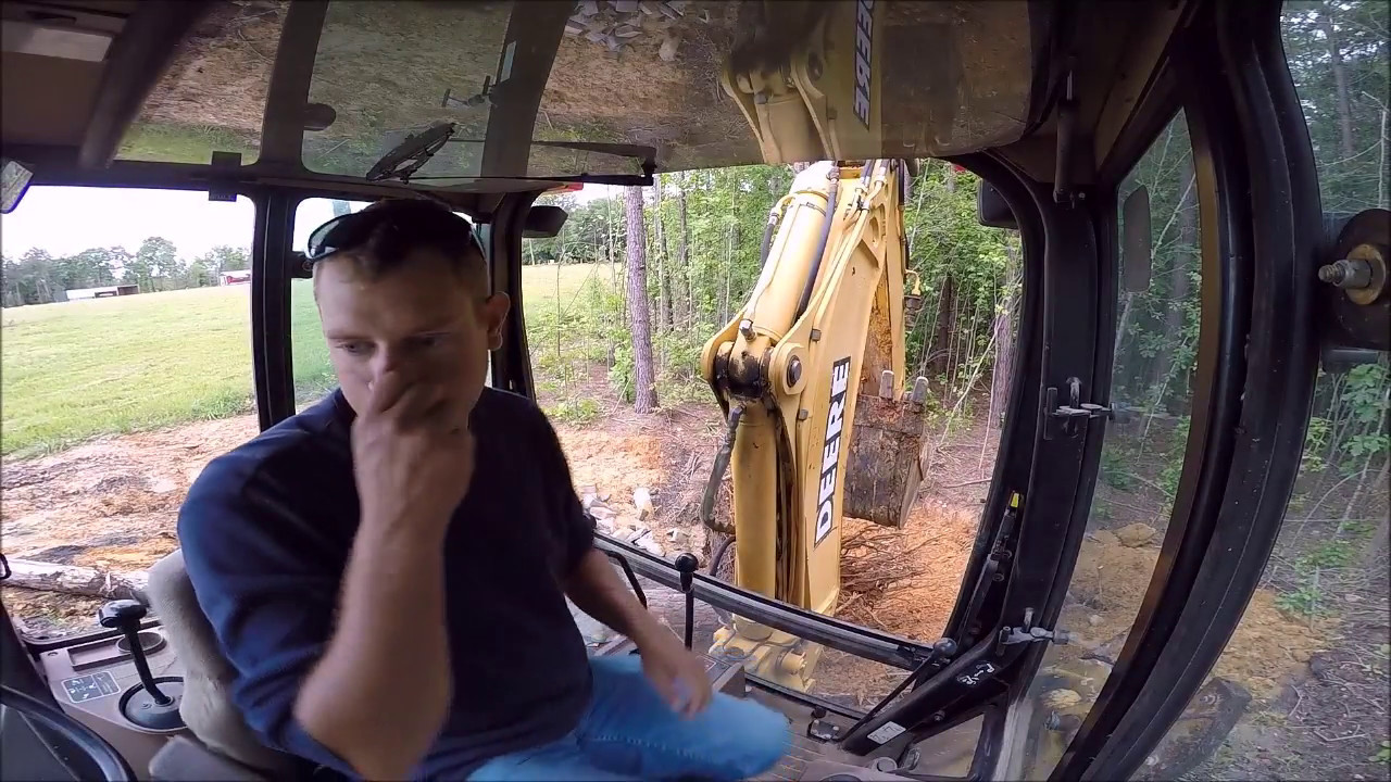 Backhoe Clearing Trees