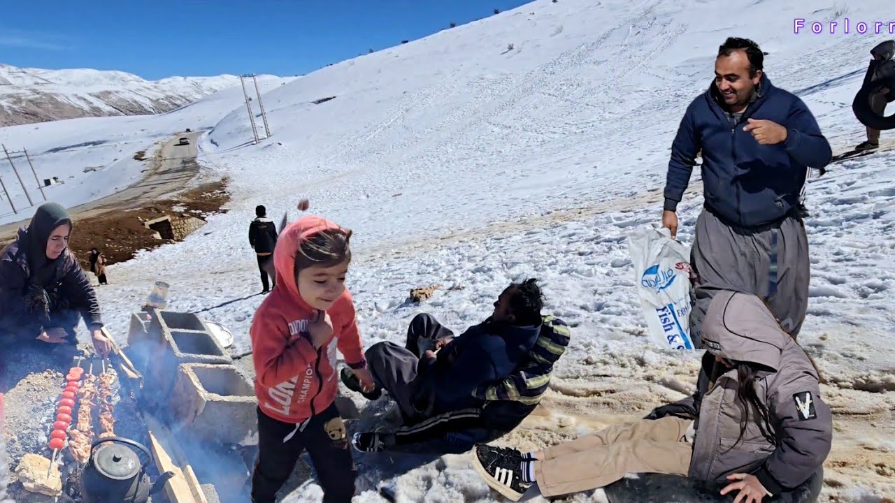 The joy of Khosrow, Sakineh, and the children in the snow: sledding and joy