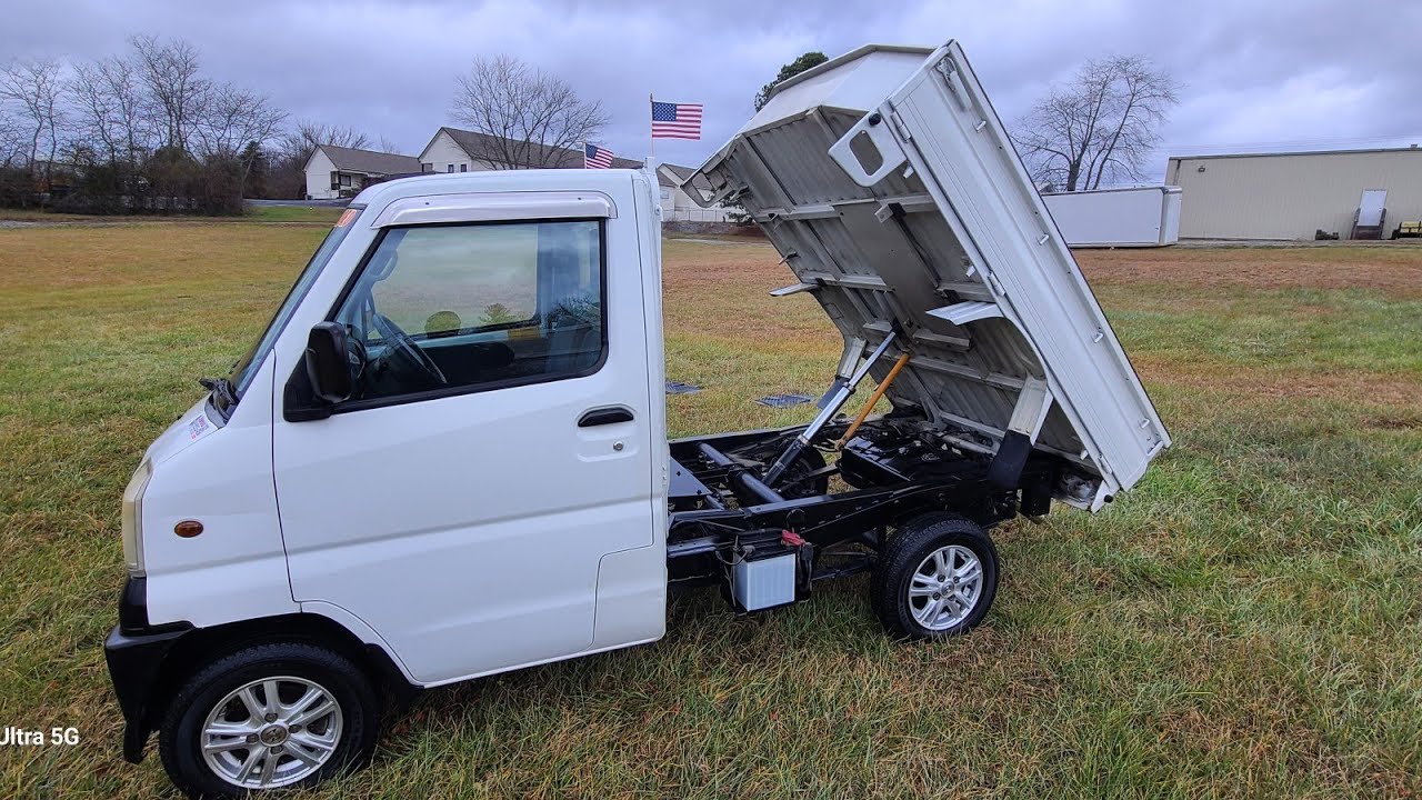 SOLD 1999 Mitsubishi MiniCab Dump Truck.  AC, HEATER,  4X4, HI-LO, POWER STEERING.