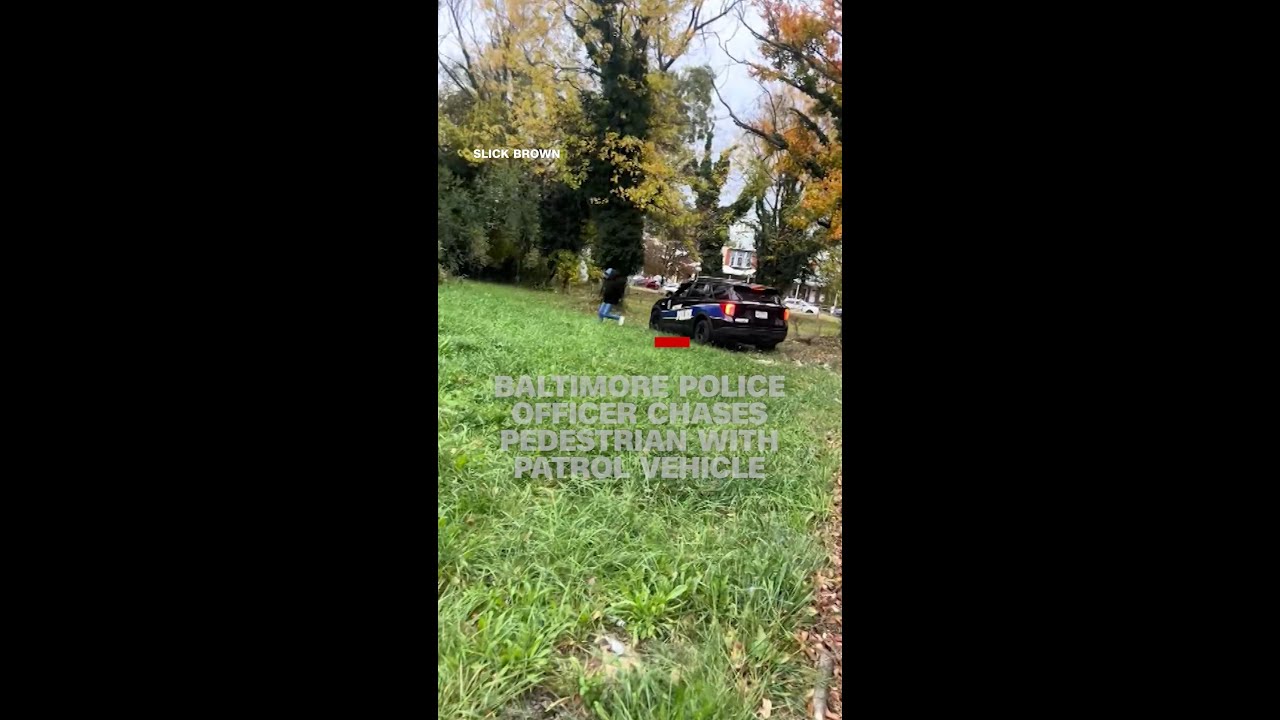 Baltimore police officer chases pedestrian with patrol vehicle