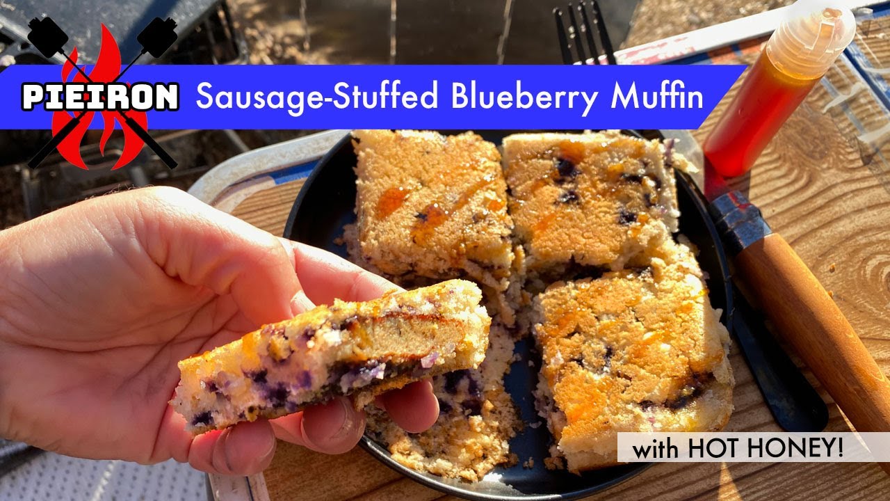 Pieiron sausage-stuffed blueberry muffin with HOT HONEY - a sweet and spicy campfire breakfast combo