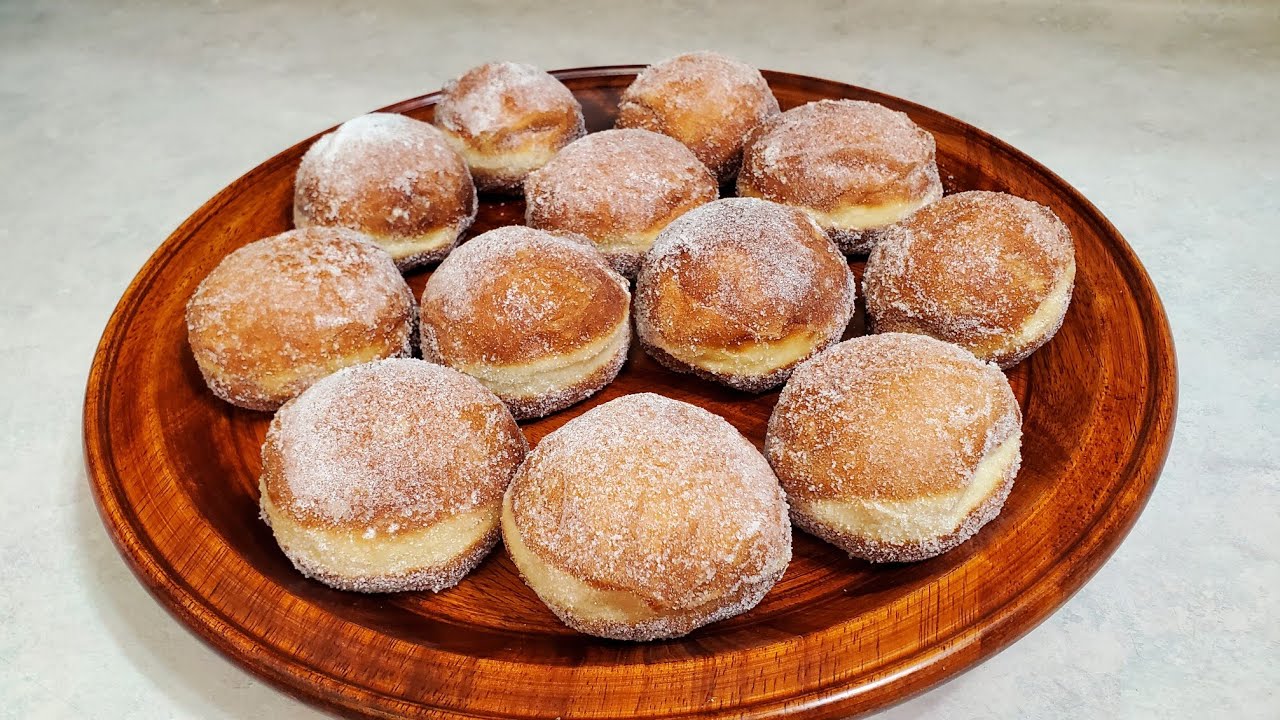 como hacer estas delisiosas bolas de  berlin fritas y rellenas de crema pastelera