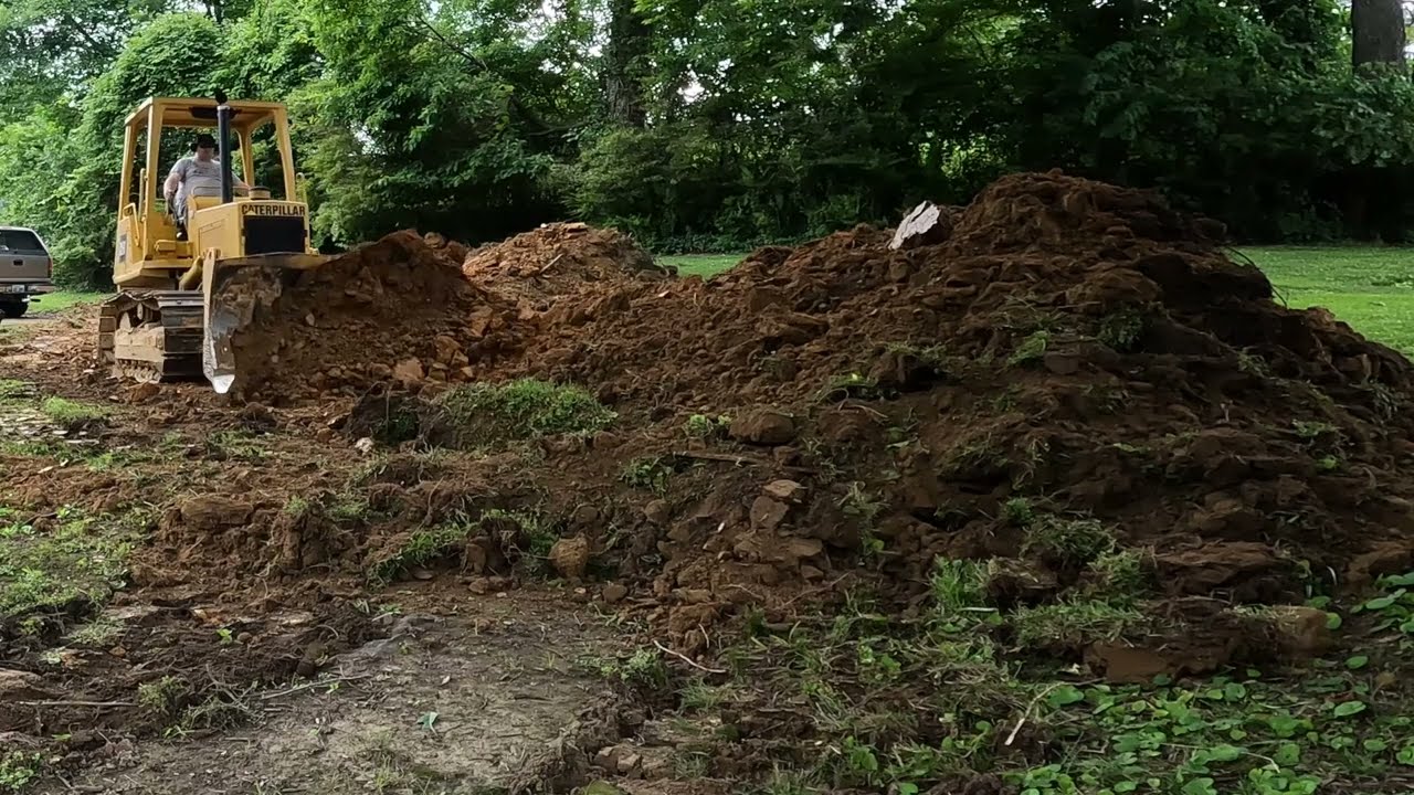Filling in swimming pool with dirt