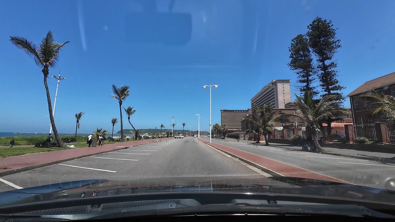 Driving on Florida road, then along the beach front to On Point Waterfront in Durban, South Africa