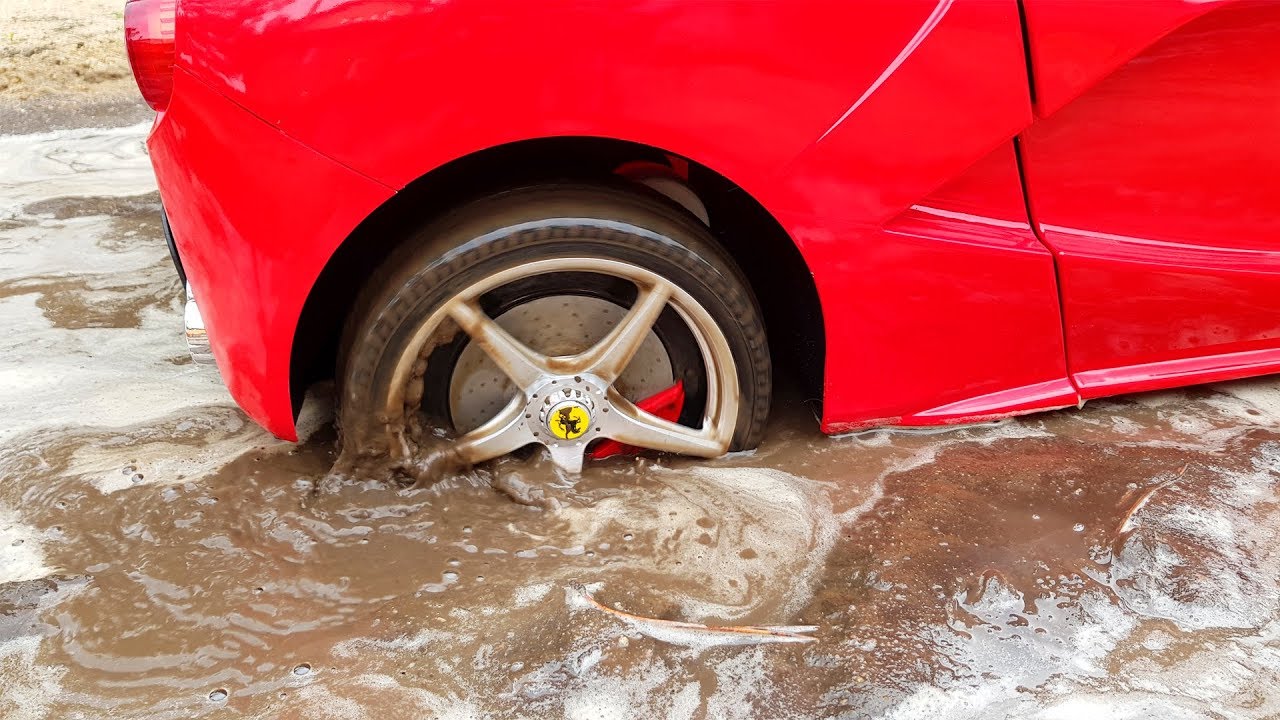 Ferrari power wheels car stuck in the mud