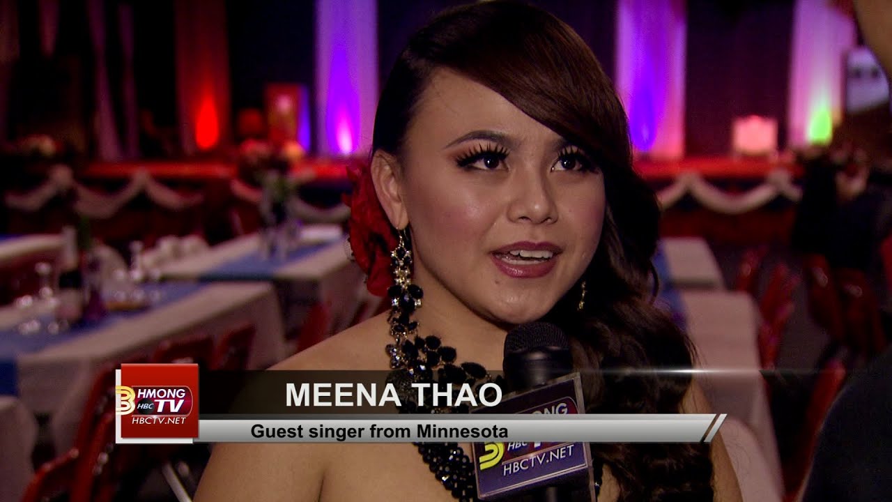 Kabyeej Vaj talks with Meena Thao, singer from Minnesota, at Hmong International New Year 2015.