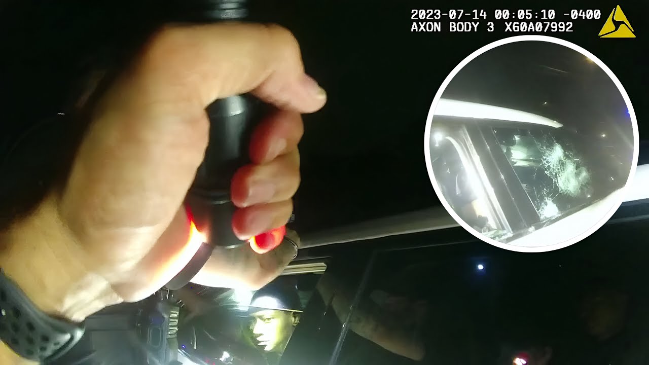 Police Smash Window After Driver Refuses to Comply During Traffic Stop