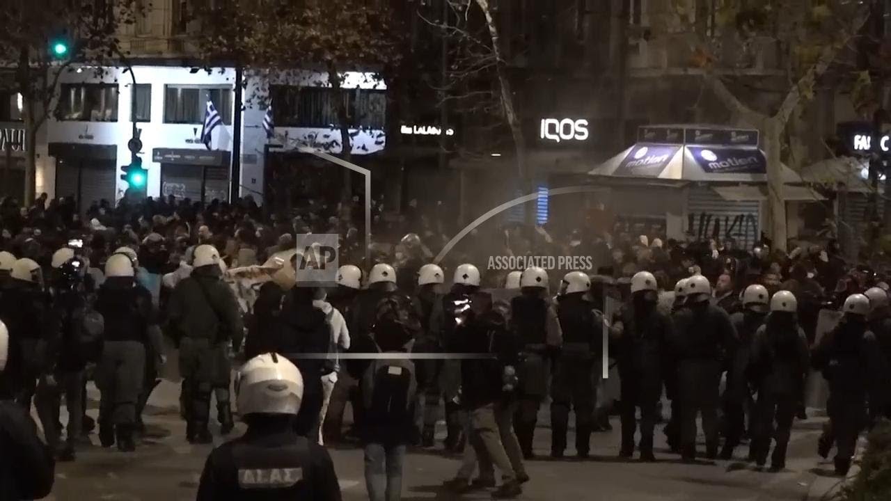 Police and protesters face off into the night following clashes on rail disaster anniversary