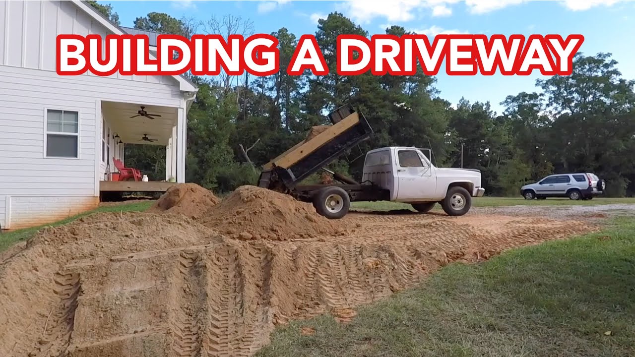 Extending my gravel driveway with a Kubota L39 and my 1988 Chevy R30 Dump Truck.
