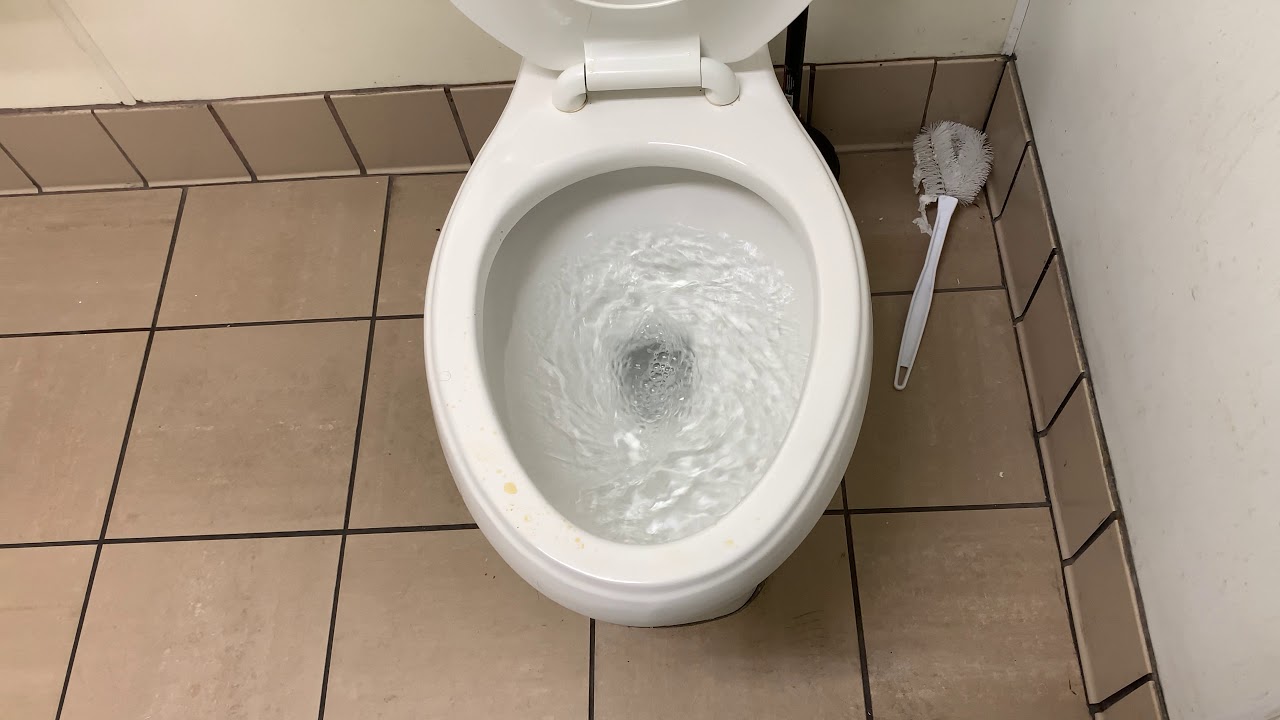 Swirly Proflo Flushometer Toilet.