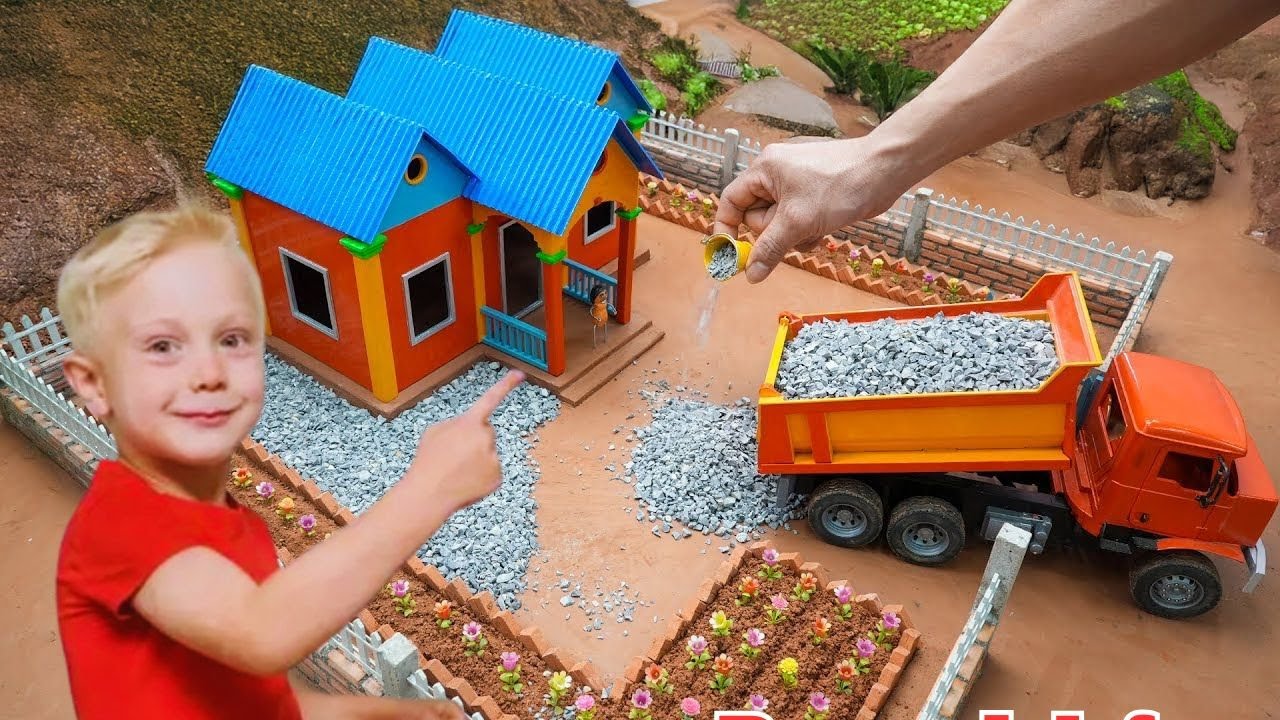 A BUILDER CREATES A MINI BRICK VILLAGE WITH LIGHTS AND RUNNING WATER