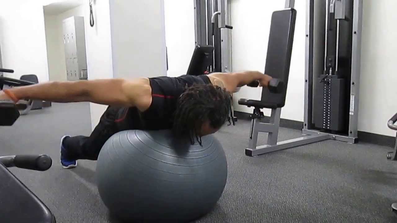 Stability ball workout with dumbbells for overall fitness