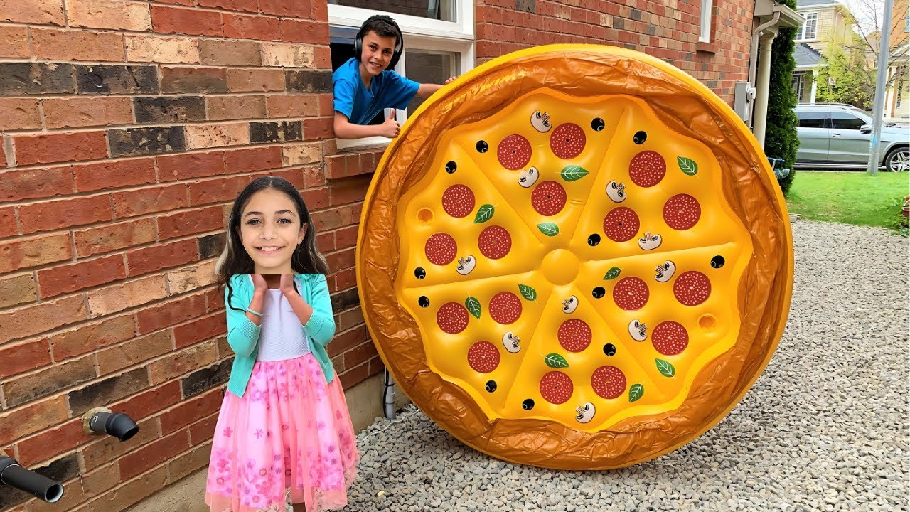 Heidi Playing with Giant Inflatable Pizza Toy