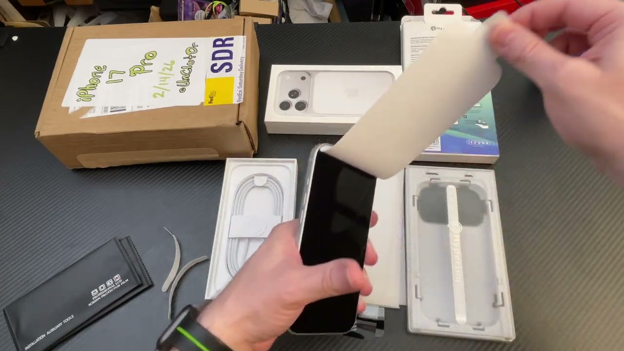 Old Man Opens iPhone 17 Pro and Immediately Puts a Screen Protector and Case