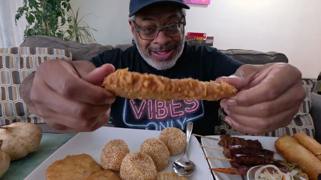 Eating the good and unique food that I bought at the Southeast Asian Outdoor Market. Something new