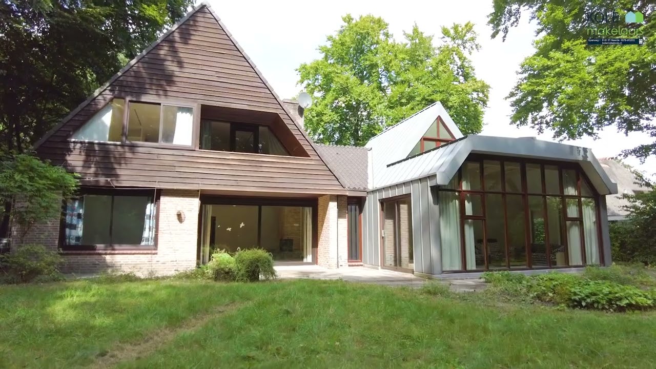 Villa met karakter en moderne uitbouw op een unieke bosrijke locatie - Noorderkampweg 7 b Wapenveld