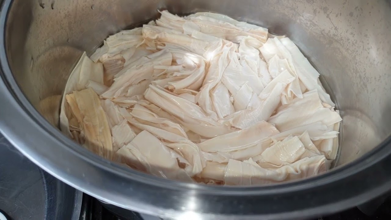 Soak Bean curd sticks and boil.