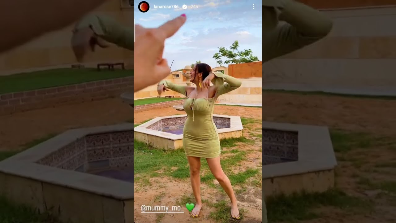 Lana rose  walks barefoot on the grass