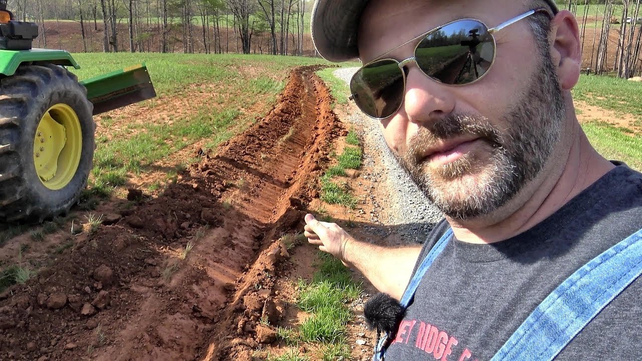 Tractors at work...How to properly ditch your driveway to stop washing!