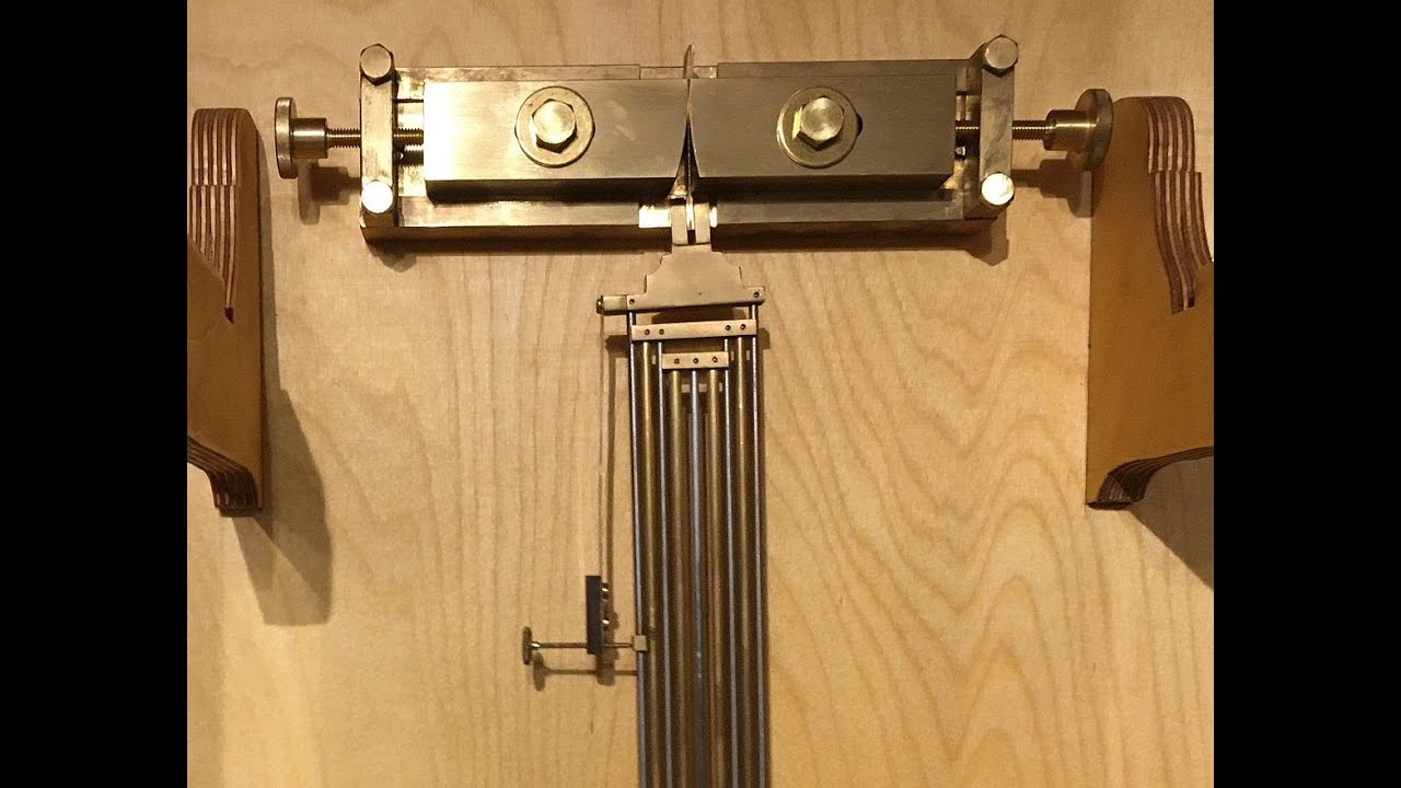 Regulating a gridiron compensation pendulum for a grasshopper clock