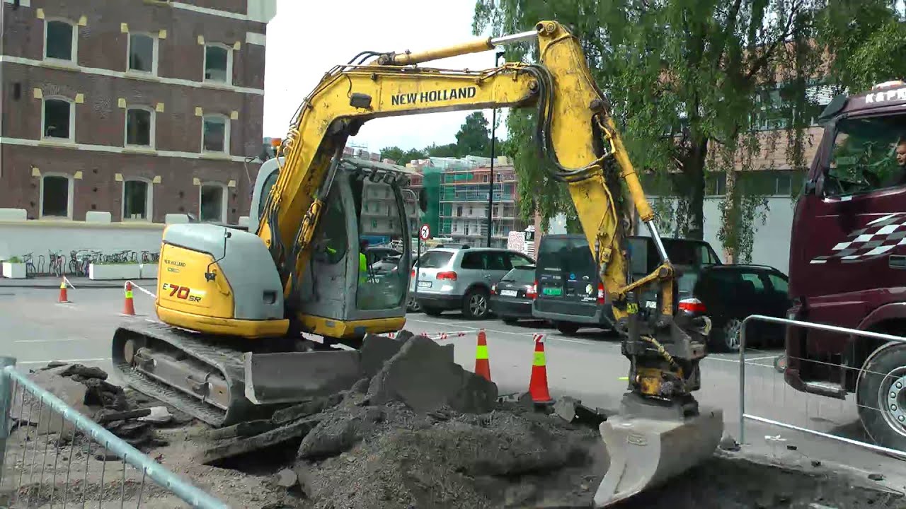 New Holland Kobelco E70SR Digging Up Asphalt