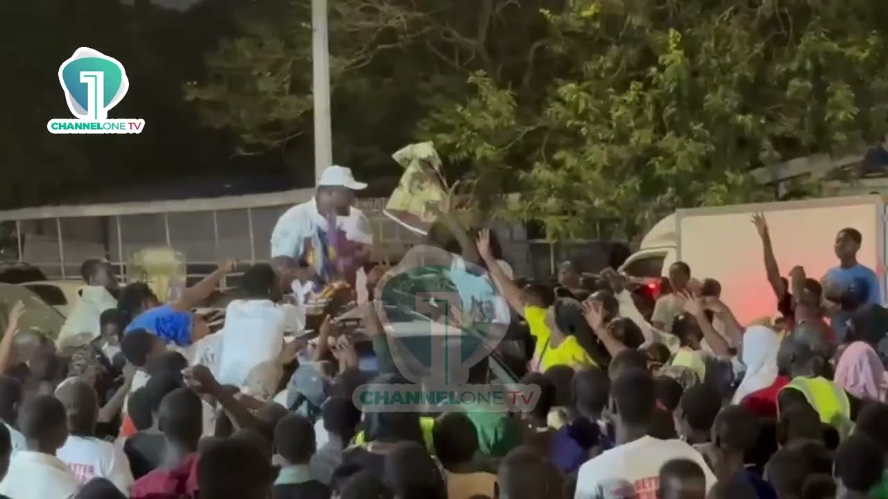 Ayawaso East residents receive pieces of cloth as they celebrate Baba Jamal's win in primaries