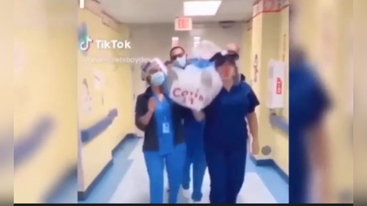 Dancing nurses carry 'coronavirus victim' in disturbing clip copying TikTok meme