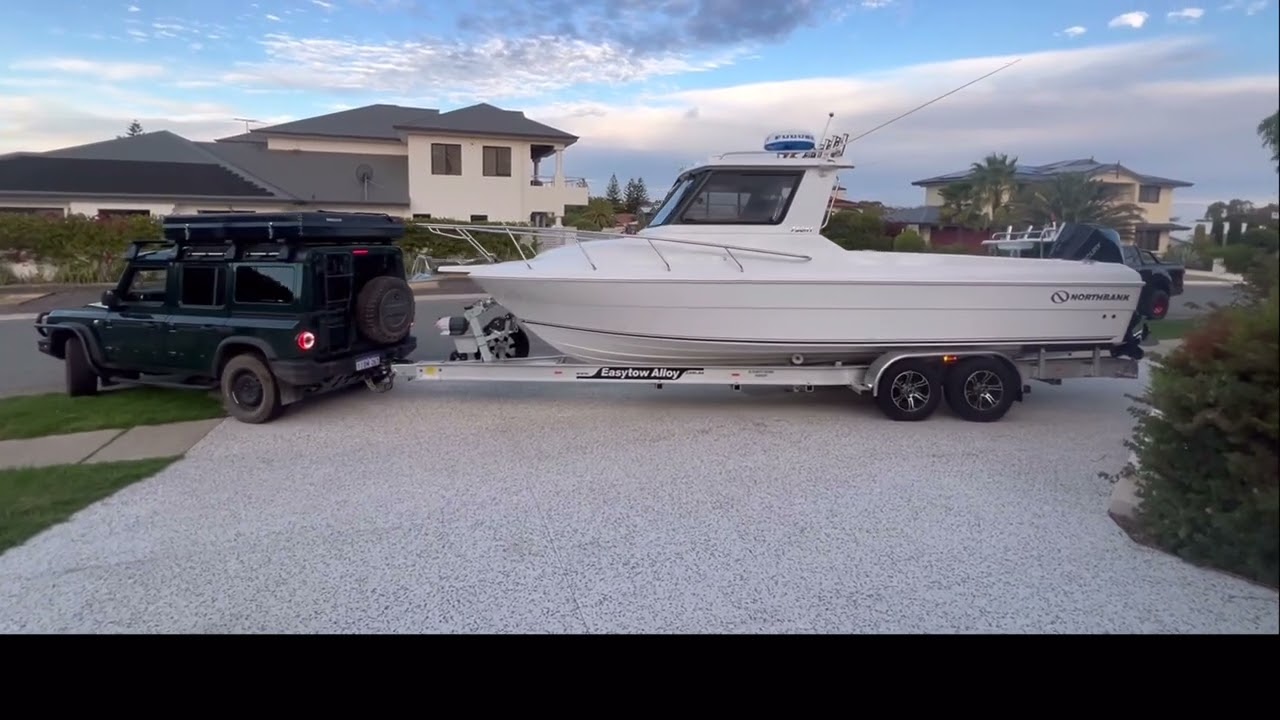 Grenadier towing and launching a Northbank Boat