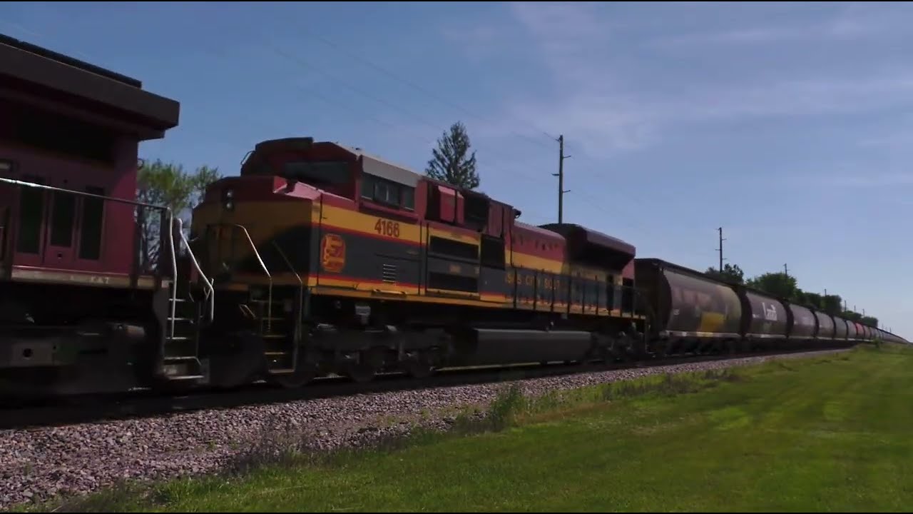 Canadian pacific 8066 leads KCS 4166 grain train with Canadian pacific 8775 as DPU 190 car train