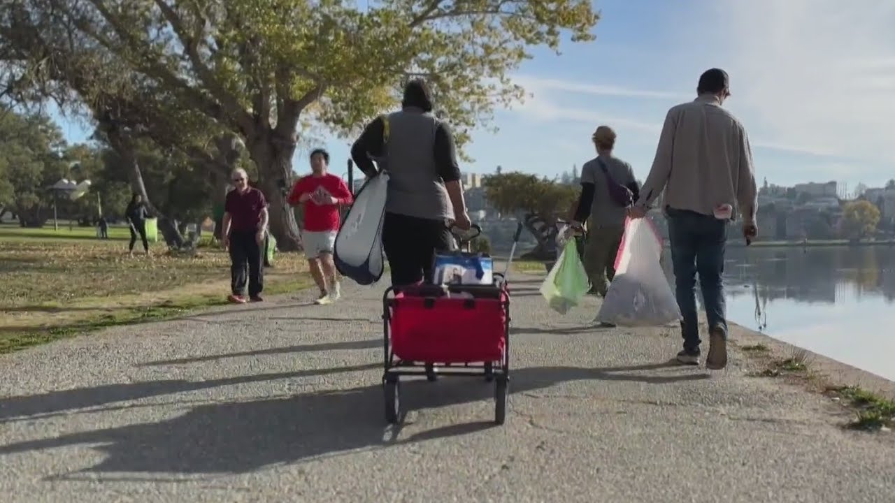 Group of volunteers bonds over cleaning up trash around Oakland's Lake Merritt