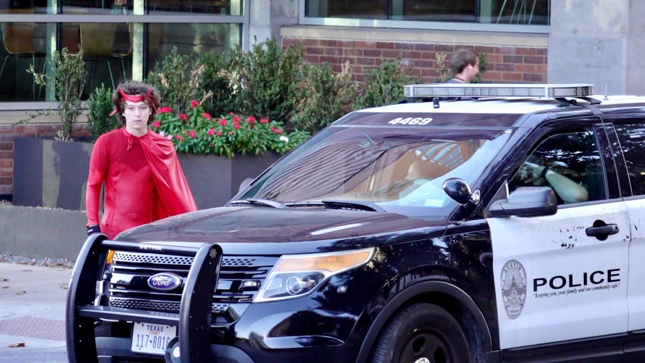 dressing up as a superhero and fighting crime