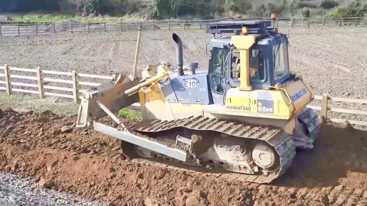 Komatsu dozer at work pushing on a road construction site #2