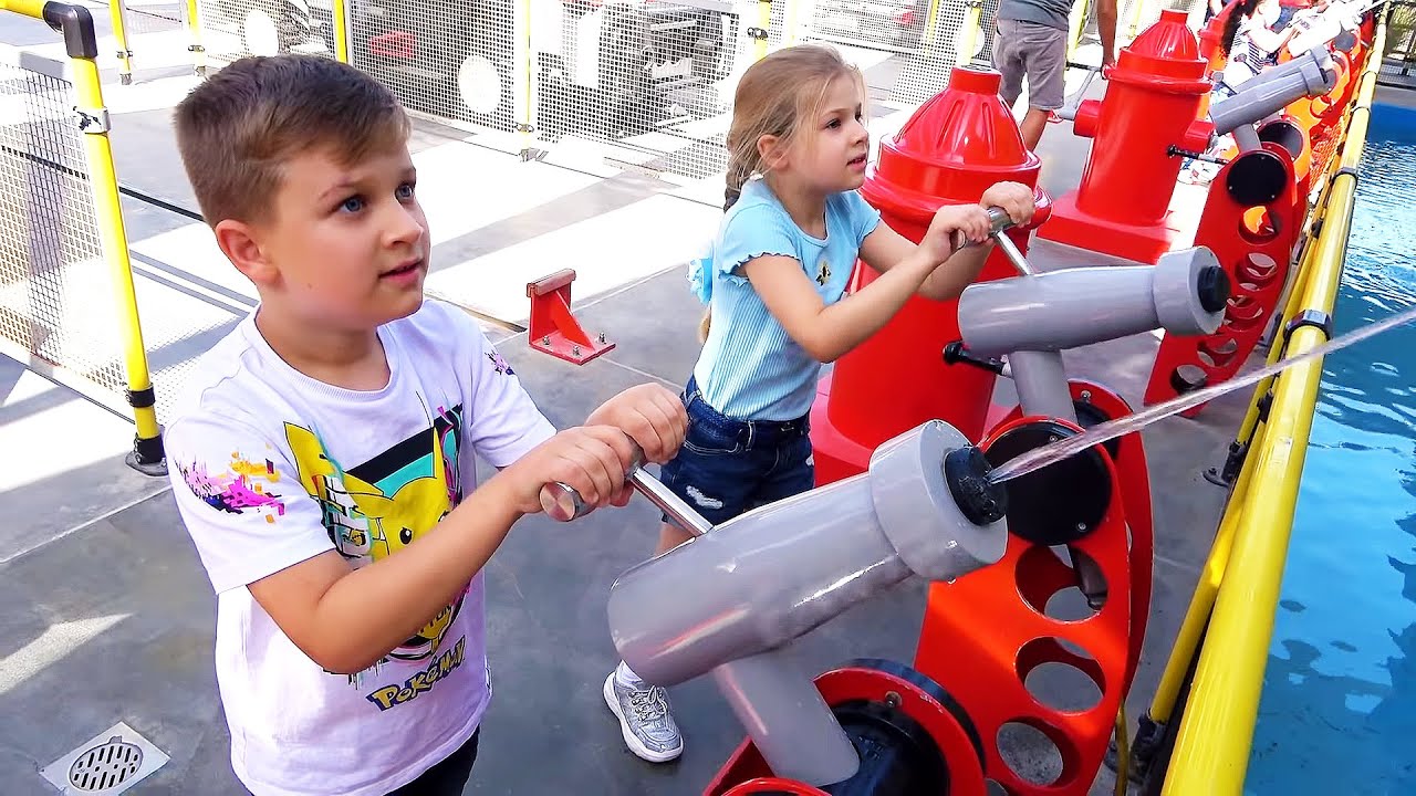 Diana and Roma interact with fun exhibits at the Legoland