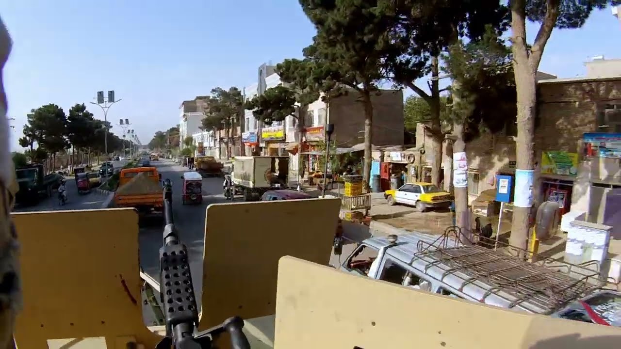 US Army Helmet Cam, Oshkosh M-ATV (MRAP all terrain vehicle) drive through Herat Afghanistan, gunner