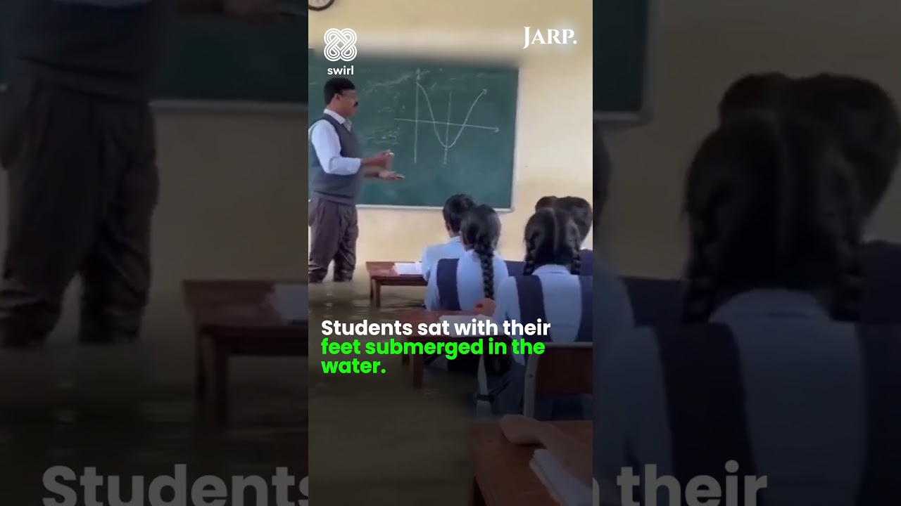 Flood Water Can't Stop Class!  Dedicated Math Teacher Continues Lesson in Waterlogged School |