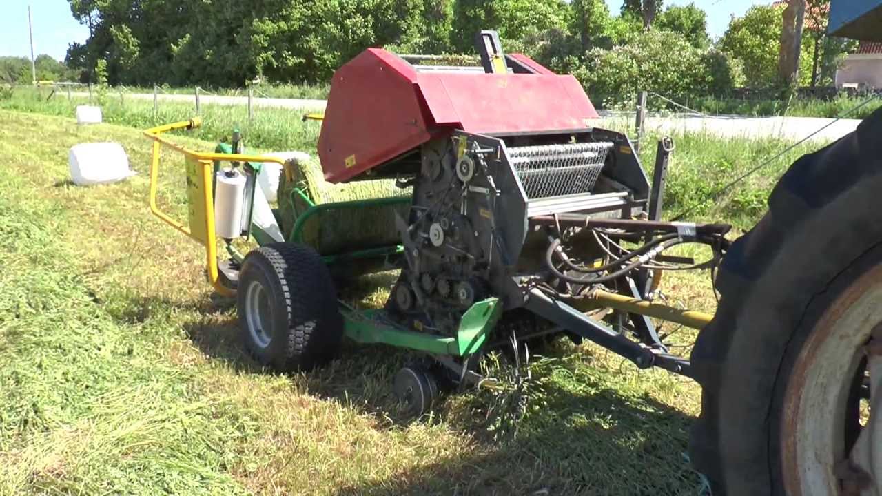 Ford 4000 runs a small hay baler with plastic wrapping