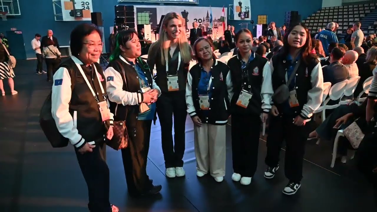 Anna Cramling taking photos with fans at Chess Olympiad Budapest