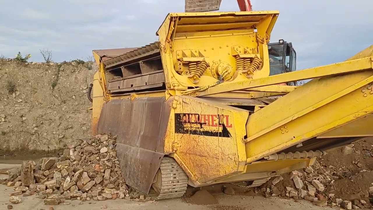OUR EXTEC ROBOTRAC SCREENING MUCK AWAY SOIL FOR CONCRETE CRUSHING LATER