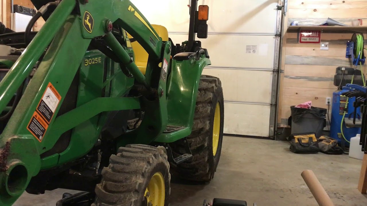 Service on the 3025E John Deere Tractor.